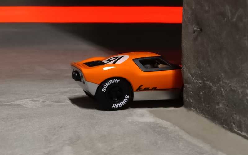 Spielzeugauto von Playforever: Ken Gibson in Orange und mit großer Startnummer ist von den US 24-Stunden Rennwagen inspiriert.